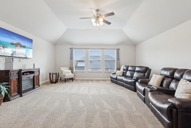3403 Majestic Pine Ln, Rosenberg, TX 77471 - living area with light colored carpet, a ceiling fan, vaulted ceiling, baseboards, and a glass covered fireplace