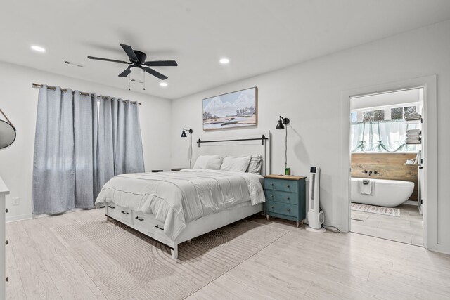 50 Berry St, Coldspring, TX 77331 - bedroom featuring light wood-style floors, recessed lighting, connected bathroom, ceiling fan, and baseboards