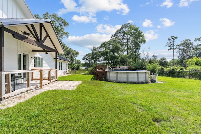 50 Berry St, Coldspring, TX 77331 - view of yard with an outdoor pool, ceiling fan, and a patio area