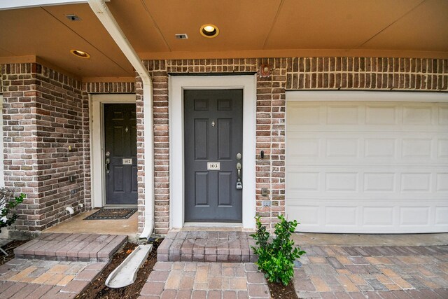 3001 Murworth Dr Unit 103, Houston, TX 77025 - entrance to property featuring brick siding and a garage