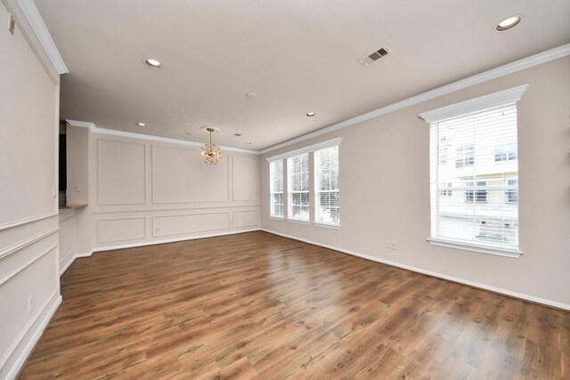 3001 Murworth Dr Unit 103, Houston, TX 77025 - spare room featuring crown molding, recessed lighting, wood finished floors, a chandelier, and baseboards