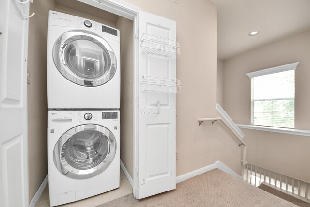 3001 Murworth Dr Unit 103, Houston, TX 77025 - laundry room featuring stacked washing machine and dryer, baseboards, carpet flooring, and recessed lighting