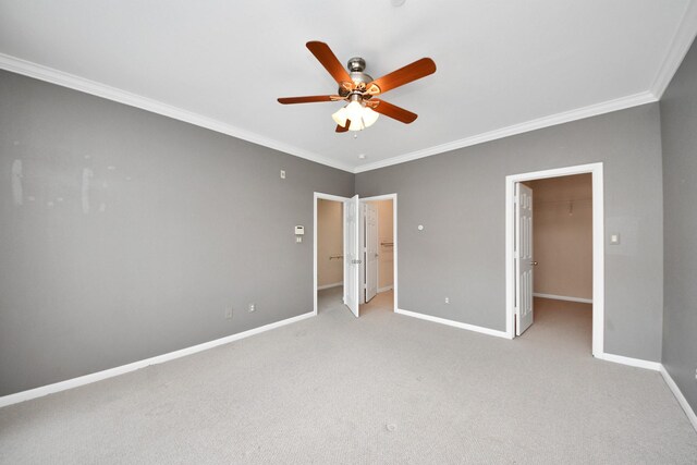 3001 Murworth Dr Unit 103, Houston, TX 77025 - unfurnished bedroom featuring a spacious closet, crown molding, baseboards, carpet flooring, and a closet