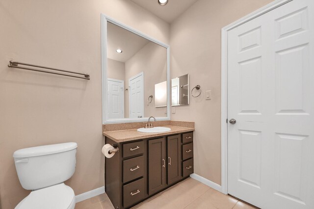 3001 Murworth Dr Unit 103, Houston, TX 77025 - bathroom with vanity, toilet, tile patterned floors, baseboards, and recessed lighting