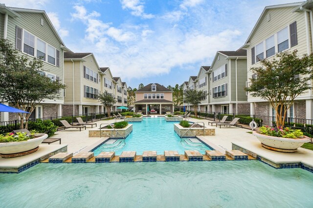3001 Murworth Dr Unit 103, Houston, TX 77025 - community pool featuring a residential view and a patio area