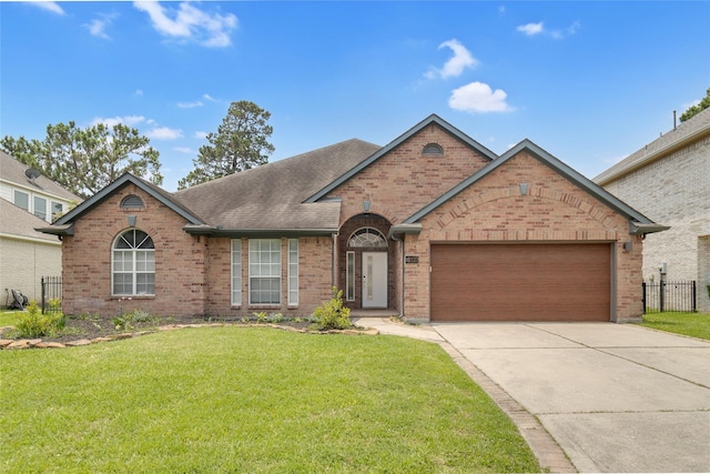 18327 Marlin Waters Dr, Humble, TX 77346 - view of front of property featuring brick siding, a garage, concrete driveway, and roof with shingles