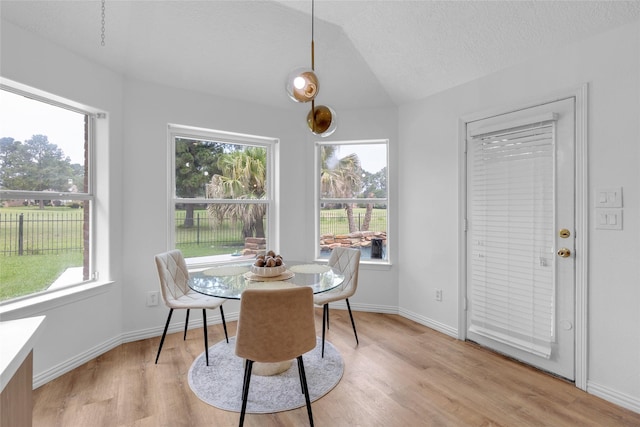 18327 Marlin Waters Dr, Humble, TX 77346 - dining room with plenty of natural light, light wood-style flooring, and baseboards