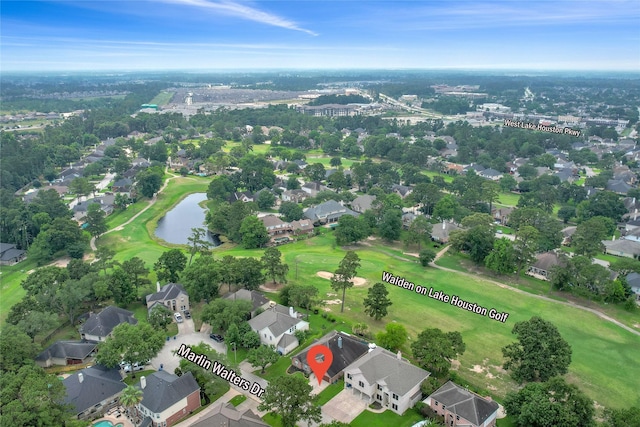 18327 Marlin Waters Dr, Humble, TX 77346 - aerial overview of property's location featuring a golf course, nearby suburban area, and a large body of water