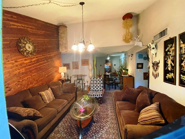 10049 Westpark Dr Unit 136, Houston, TX 77042 - living room with a chandelier and wood walls