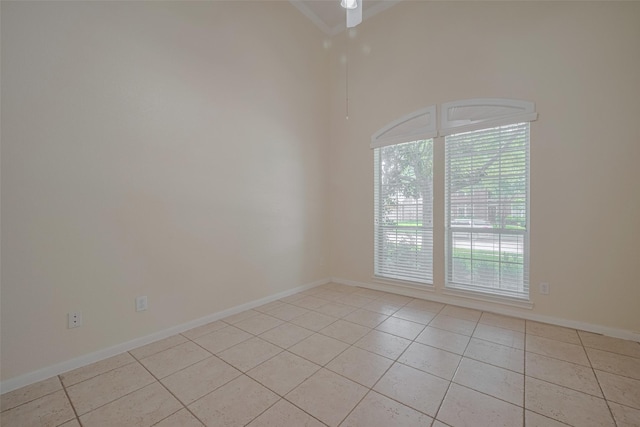 4515 Tremont Glen Ln, Katy, TX 77494 - spare room with light tile patterned floors, baseboards, a ceiling fan, and crown molding