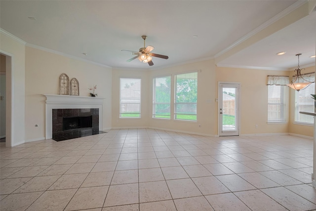 4515 Tremont Glen Ln, Katy, TX 77494 - unfurnished living room with light tile patterned flooring, ornamental molding, ceiling fan, baseboards, and a tile fireplace