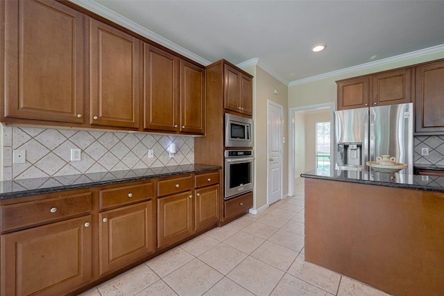 4515 Tremont Glen Ln, Katy, TX 77494 - kitchen with appliances with stainless steel finishes, dark stone countertops, crown molding, tasteful backsplash, and brown cabinets