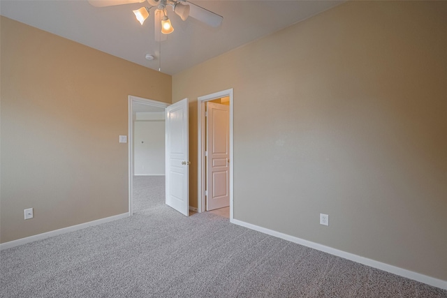 4515 Tremont Glen Ln, Katy, TX 77494 - unfurnished room featuring carpet floors, ceiling fan, baseboards, and a smoke detector