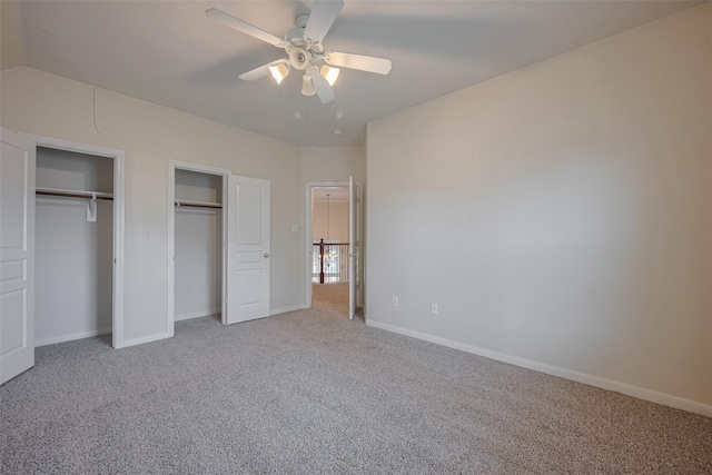 4515 Tremont Glen Ln, Katy, TX 77494 - unfurnished bedroom featuring carpet floors, two closets, baseboards, and a ceiling fan