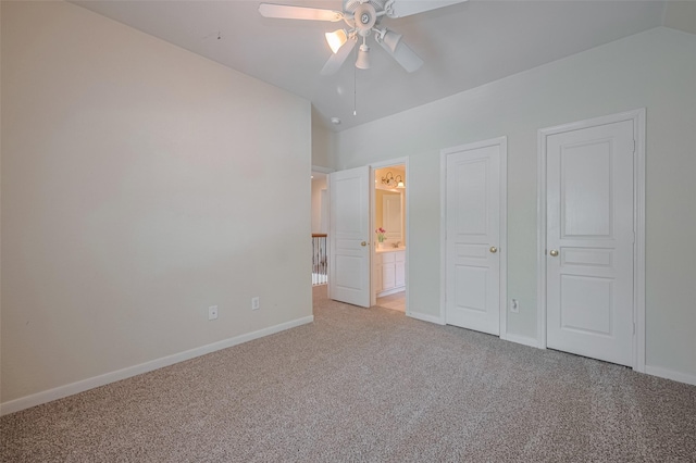 4515 Tremont Glen Ln, Katy, TX 77494 - unfurnished bedroom with light colored carpet, vaulted ceiling, baseboards, ensuite bathroom, and a ceiling fan