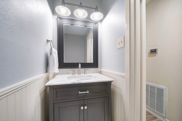 2311 Jackson Ln, League City, TX 77573 - bathroom with wainscoting and vanity