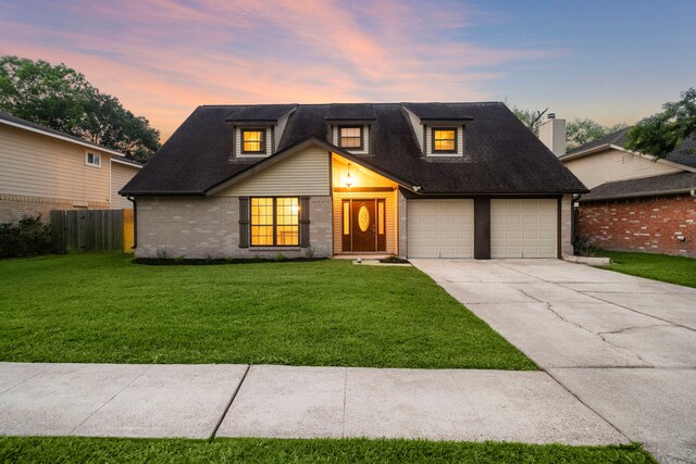 2311 Jackson Ln, League City, TX 77573 - view of front facade with concrete driveway, brick siding, a garage, and roof with shingles