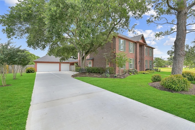 1805 Twin Oaks St, Friendswood, TX 77546 - colonial home featuring brick siding, a front lawn, and concrete driveway