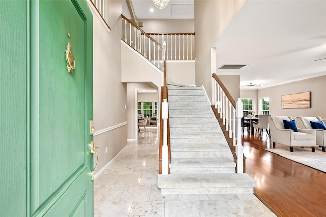 1805 Twin Oaks St, Friendswood, TX 77546 - foyer featuring stairway, baseboards, and ornamental molding