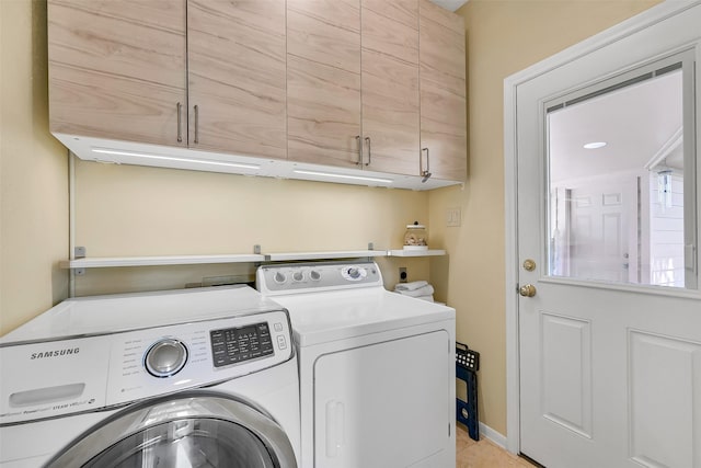 1805 Twin Oaks St, Friendswood, TX 77546 - laundry area featuring washing machine and dryer, cabinet space, and light tile patterned flooring