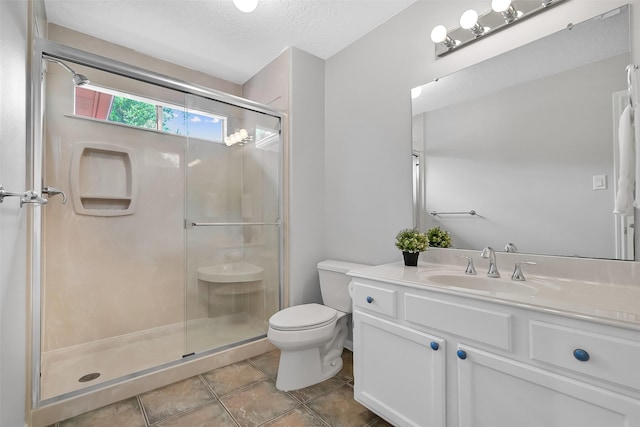1805 Twin Oaks St, Friendswood, TX 77546 - bathroom featuring toilet, a shower stall, vanity, tile patterned floors, and a textured ceiling