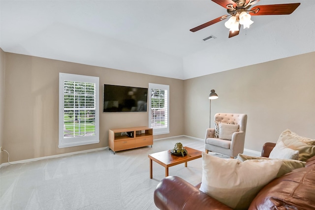 1805 Twin Oaks St, Friendswood, TX 77546 - living room featuring healthy amount of natural light, ceiling fan, baseboards, vaulted ceiling, and light colored carpet