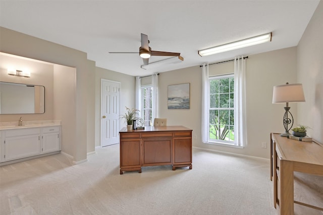 1805 Twin Oaks St, Friendswood, TX 77546 - home office featuring light carpet, a sink, a ceiling fan, and baseboards