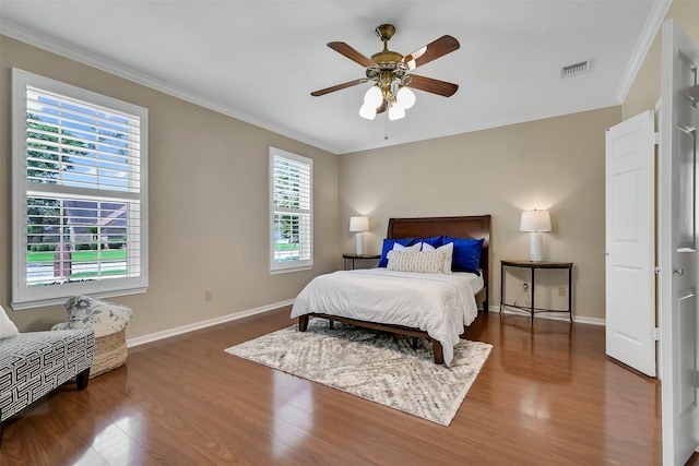 1805 Twin Oaks St, Friendswood, TX 77546 - bedroom with ornamental molding, wood finished floors, baseboards, and a ceiling fan