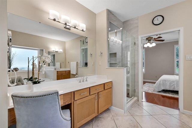1805 Twin Oaks St, Friendswood, TX 77546 - ensuite bathroom with vanity, a stall shower, ceiling fan, baseboards, and tile patterned floors