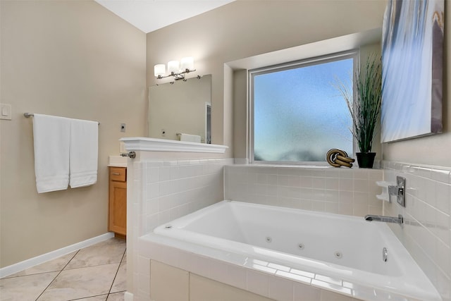 1805 Twin Oaks St, Friendswood, TX 77546 - bathroom featuring vanity, a jetted tub, baseboards, and tile patterned flooring