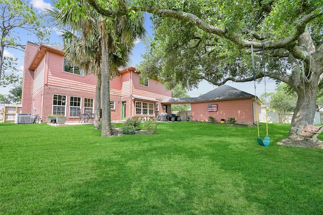 1805 Twin Oaks St, Friendswood, TX 77546 - back of house with a lawn, brick siding, and cooling unit