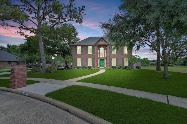 1805 Twin Oaks St, Friendswood, TX 77546 - view of front of property featuring a yard and brick siding