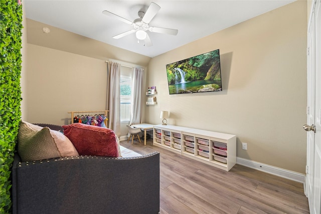 24747 Ballad Dr, Katy, TX 77493 - living room with wood finished floors, baseboards, and a ceiling fan