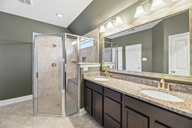 24747 Ballad Dr, Katy, TX 77493 - bathroom featuring double vanity, a stall shower, baseboards, and vaulted ceiling