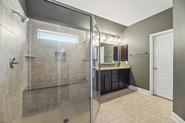 24747 Ballad Dr, Katy, TX 77493 - bathroom featuring a tile shower, vanity, and tile patterned flooring