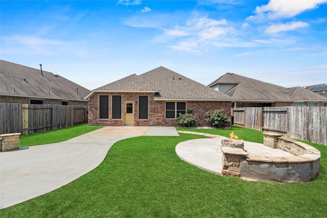 24747 Ballad Dr, Katy, TX 77493 - back of house with an outdoor fire pit, brick siding, a shingled roof, and a patio