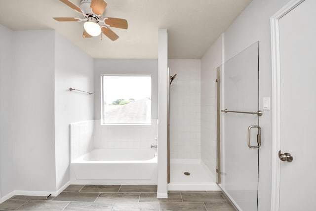 4310 Lucas Trace Ct, Houston, TX 77066 - full bathroom with a garden tub, a stall shower, ceiling fan, and baseboards