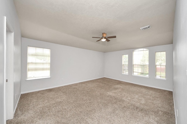4310 Lucas Trace Ct, Houston, TX 77066 - carpeted spare room featuring ceiling fan, baseboards, and a textured ceiling
