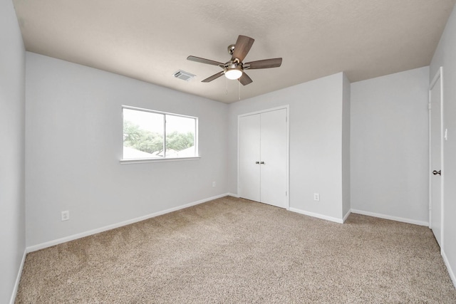 4310 Lucas Trace Ct, Houston, TX 77066 - unfurnished bedroom featuring carpet flooring, a closet, baseboards, and ceiling fan