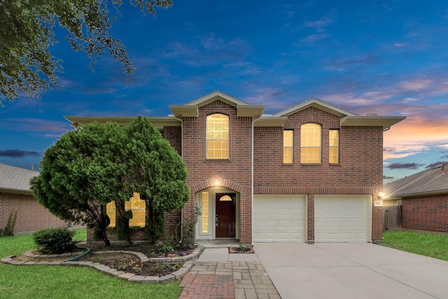 4310 Lucas Trace Ct, Houston, TX 77066 - traditional-style house with concrete driveway, an attached garage, and brick siding