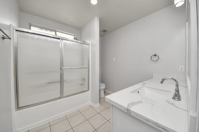 4310 Lucas Trace Ct, Houston, TX 77066 - bathroom with vanity, toilet, bath / shower combo with glass door, and tile patterned floors