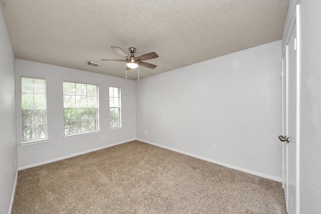 4310 Lucas Trace Ct, Houston, TX 77066 - carpeted spare room featuring ceiling fan, baseboards, and a textured ceiling