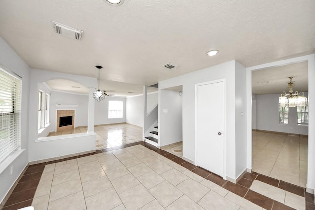 4310 Lucas Trace Ct, Houston, TX 77066 - unfurnished living room featuring tile patterned floors, a tile fireplace, and baseboards