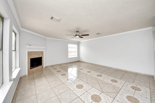 4310 Lucas Trace Ct, Houston, TX 77066 - unfurnished living room featuring light tile patterned flooring, ceiling fan, ornamental molding, a fireplace, and a textured ceiling