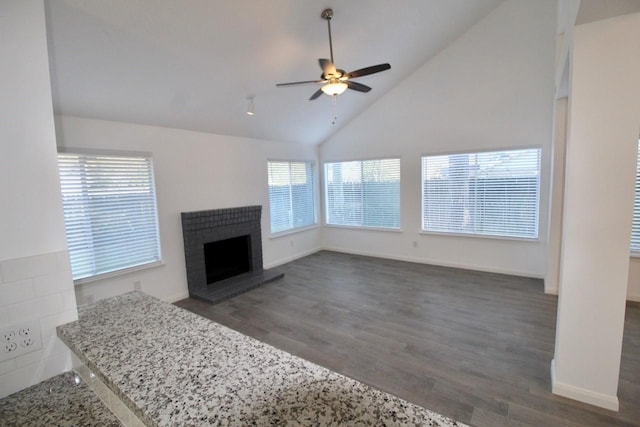 5326 Village Springs Dr, Houston, TX 77339 - unfurnished living room with wood finished floors, ceiling fan, a fireplace, baseboards, and high vaulted ceiling