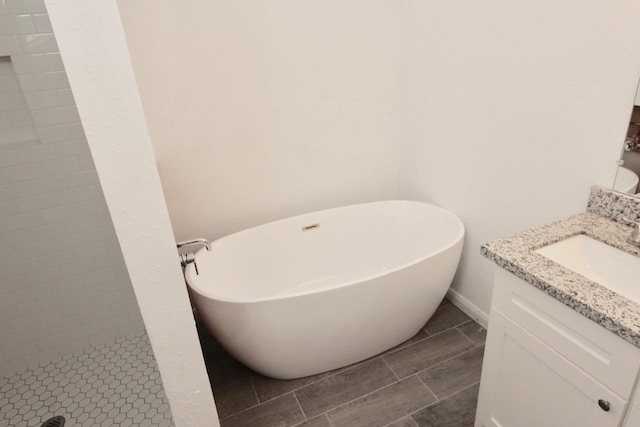 5326 Village Springs Dr, Houston, TX 77339 - full bathroom with vanity, a freestanding tub, a stall shower, and tile patterned flooring
