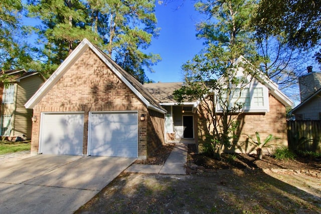 5326 Village Springs Dr, Houston, TX 77339 - view of front facade featuring brick siding, a garage, and driveway