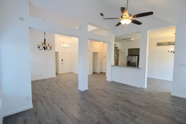 5326 Village Springs Dr, Houston, TX 77339 - unfurnished living room with a chandelier, dark wood-style floors, a ceiling fan, high vaulted ceiling, and baseboards