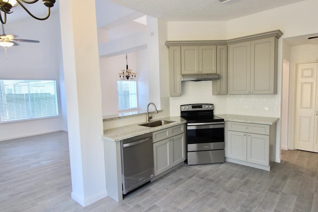 5326 Village Springs Dr, Houston, TX 77339 - kitchen featuring stainless steel appliances, a sink, a chandelier, and gray cabinets