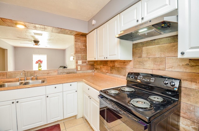 7373 Cook Rd, Houston, TX 77072 - kitchen featuring black / electric stove, a sink, ceiling fan, tasteful backsplash, and under cabinet range hood